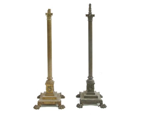 A near pair of brass Corinthian column standard lamps,late 19th century, on stepped bases and bold paw feet,127 and 135cm hig