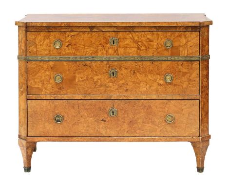 A Baltic burr walnut commode, early 19th century, patch veneered with a band of applied leaf chased gilt metal, to canted cor