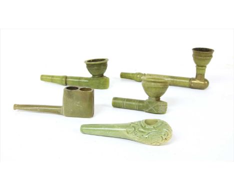 Five green stone tobacco or opium pipes,19th century, Bokhara, three with turned bowls and shafts, one mounted with brass,lar