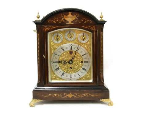 An Edwardian inlaid mahogany three-train bracket clock,the dial with foliate engraved decoration and three subsidiary dials: 