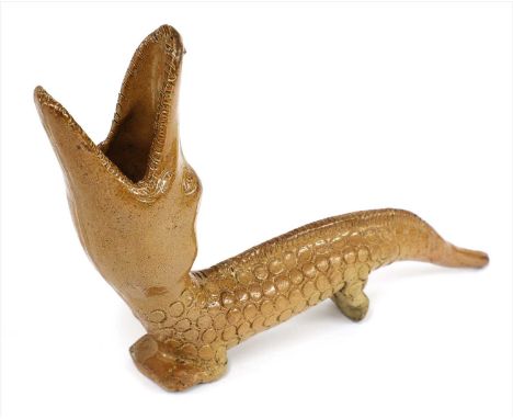 A Staffordshire stoneware pipe,c.1800, in the form of a crocodile with its jaw open, with a stamped scaled body,25cm longProv