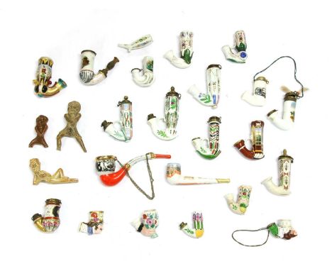 Twenty German porcelain pipe bowls,variously decorated, two Soviet era pipes, one painted with Baku oil fields and a hammer a