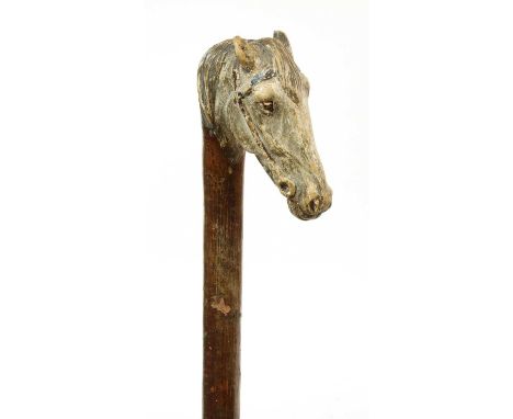 A Swaine-Brigg horse's head walking stick,hazel, the handle carved with the head of a grey horse with head collar, stamped 'S