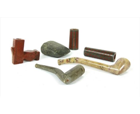 A North American catlinite pipe,with a geometric chamfered bowl and wrigglework borders,6.5cm wide,two catlinite and lead inl
