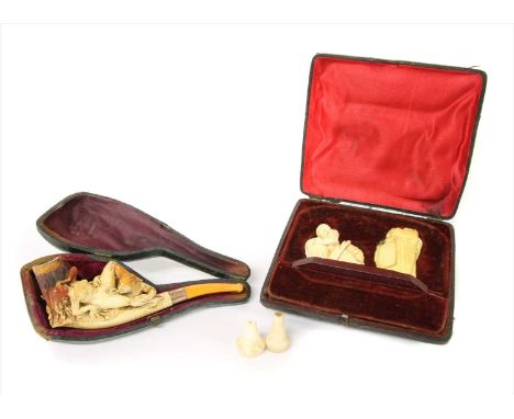 A pipe and two erotic meerschaum cheroot holders,late 19th century, Austrian, the first modelled as a man performing oral sti