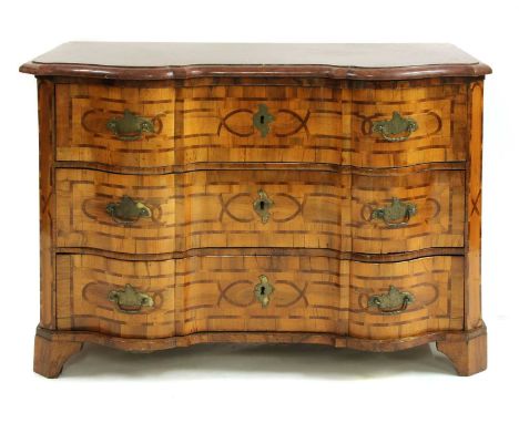An inlaid walnut commode,South Germany, 18th century, the shaped rouge marble top over a serpentine front with three long dra