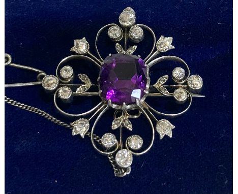 Fine diamond and amethyst pendant brooch large central amethyst measures approx 10mm by 9mm set in white gold with diamonds a