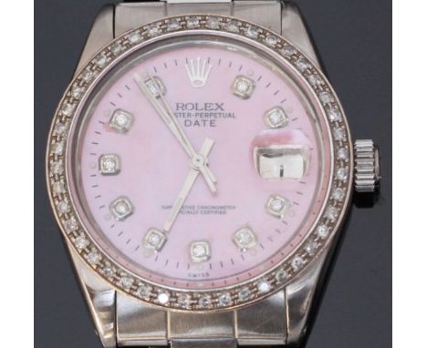 A stainless steel Rolex 'Date' wristwatch c.1970. The pearlescent pink dial with diamond dot markers denoting hours, date ape