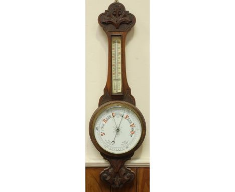 A late Victorian aneroid barometer with white painted dial, approx. 82cm high