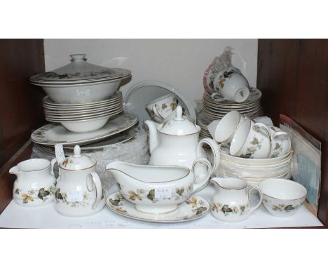 SECTION 1. A Royal Doulton 'Larchmont' pattern dinner and tea service comprising eight-each dinner plates, side plates, large