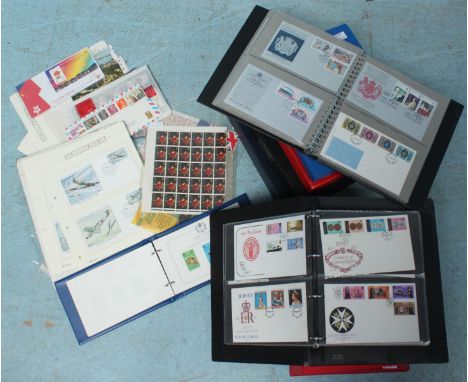 A quantity of approximately 390 first day covers in albums, together with a small collection of assorted used and mint world 