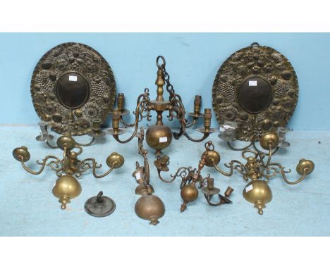 A pair of 19th century oval brass two-light wall sconces embossed with fruit and flowers, together with three brass wall scon