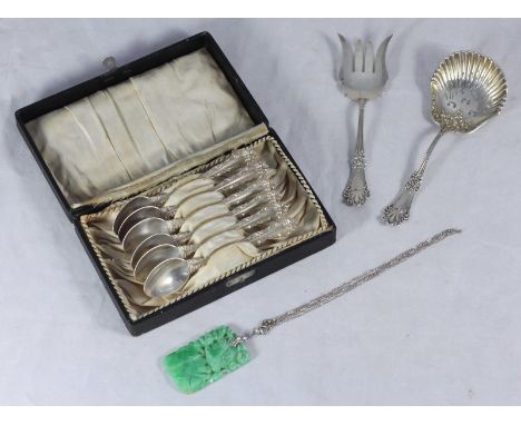 A sterling silver serving fork and a silver sifter, together with a boxed set of six silver coffee spoons and a pierced and c