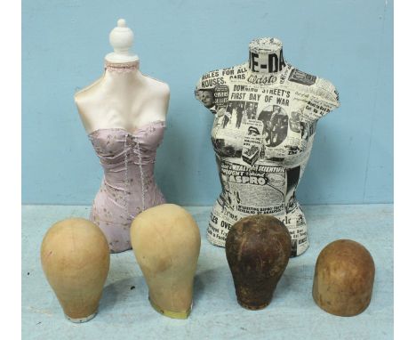 Two female mannequin torsos, one in Daily Mirror newspaper decoupage, the other with material lining and pink dressing, toget