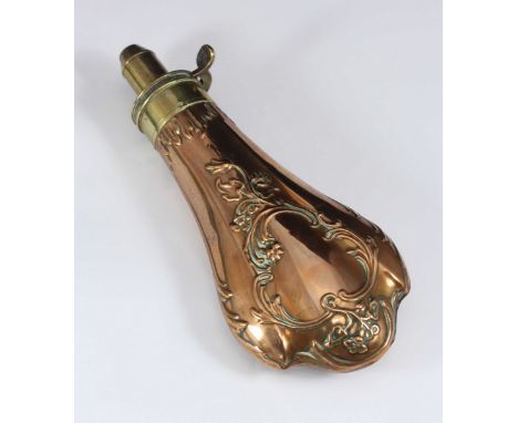 A brass and copper gunpowder flask marked Bartram & Co with scrolling floral decoration, approx. 21cm long (lacking cover), t