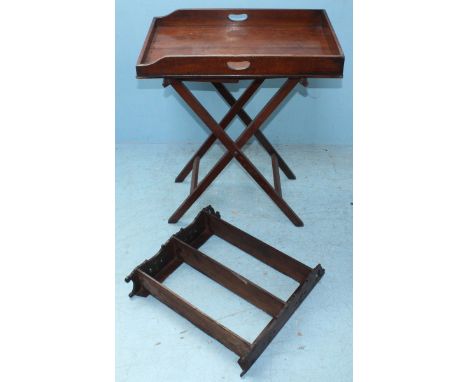 An early 20th century stained walnut butlers tray on stand, together with a three-tier hanging shelf unit with carved decorat