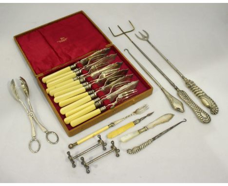 Two large silver-handled forks and two silver-handled button hooks, together with a cased set of six silver-plated fish knive