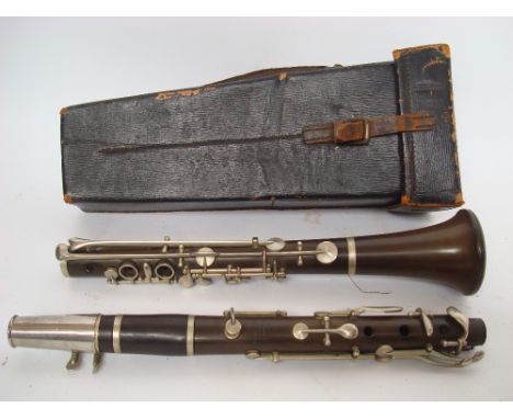 A mid 20th Century Boosey & Co bakelite and ebony clarinet in fitted leather case.