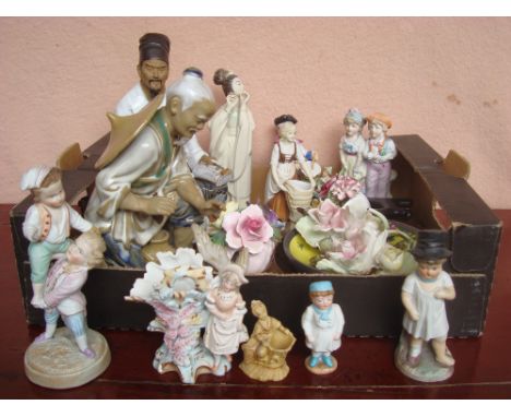 A mixed lot of ceramic ornaments to include a Chinese figure of Confucius, a pair of Capodimonte flower encrusted chamber sti