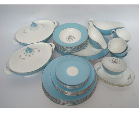 A Royal Doulton Caprice pattern part tea and dinner service comprising seven dinner plates, seven medium plates, eight desser
