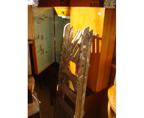 A mid 20th Century tool cabinet with fitted interior and a folding wooden step ladder (2). 