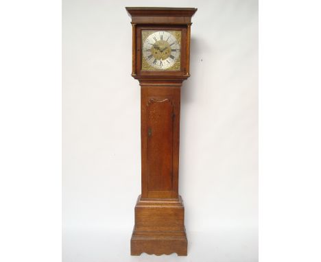 An 18th Century oak longcase clock, the 12" square brass dial with silvered chapter ring, Roman and Arabic numerals, minute t