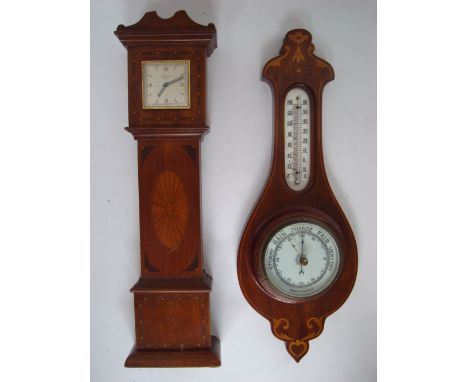 An early 20th Century mahogany miniature novelty longcase clock, the case inlaid with satinwood oval fan patterae, the moveme