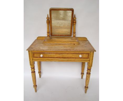 A late Victorian scumbled and painted pine dressing table with frieze drawer, on turned legs together with a matching swing t