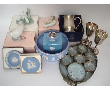 A mixed lot comprising Nao figures: 'Nino Jesus', 'Group of Ducks' and a duck all boxed, Wedgwood blue Jasperware: footed bow