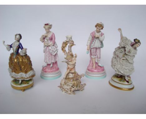 A pair of 19th Century Paris porcelain figures of a gallant and companion in 18th Century dress, on socle bases, 30cm high to