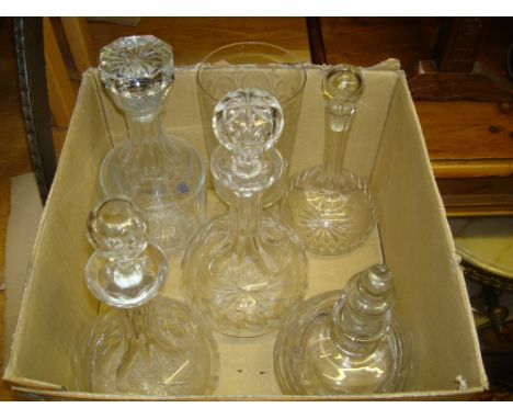 A Galway crystal decanter and stopper together with four other decanters and a celery vase engraved with fern leaves and othe