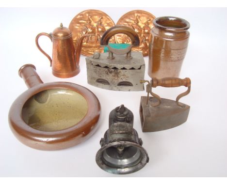 A mixed lot to include two Arts and Crafts copper wall plaques embossed with galleons, a copper coffee pot with hammered fini