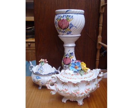 A Continental faience pottery planter on stand and two twin handled tureens and covers (3). 