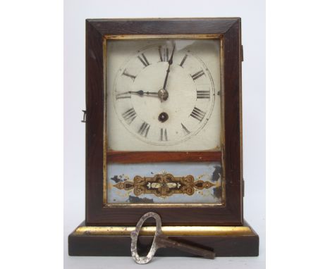 A 19th century American 30 hour mantel clock with square enamel dial encased in simulated rosewood.