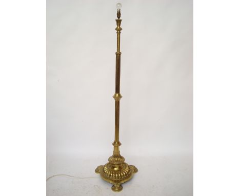 A late Victorian gilt brass telescopic standard lamp, the reeded column with ball and socket adjustable  light fitting on gad