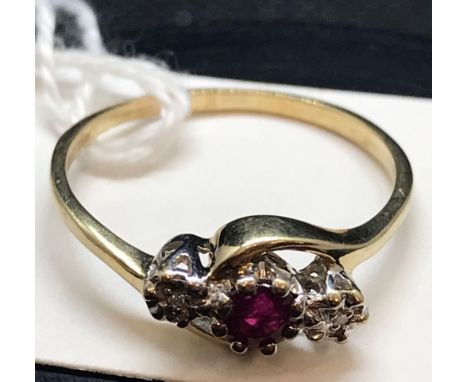 A 3 STONE RUBY &amp; DIAMOND CROSS OVER RING SET IN 9ct