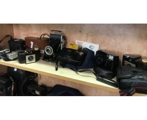 SHELF OF VARIOUS CAMERAS INCL; KODAK DAKON 2 SHUTTER CAMERA, OLYMPUS, NIKON, SAMSUNG, PENTAK ZOOM 70 &amp; OTHERS