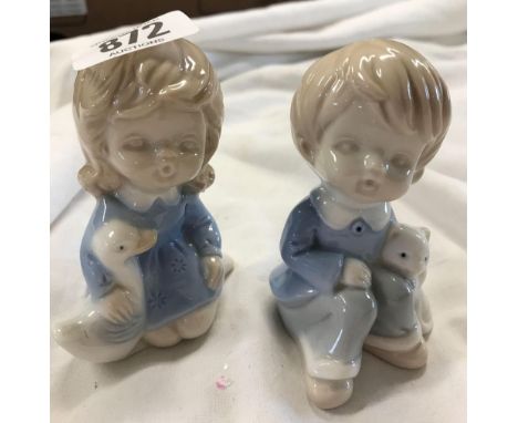 PAIR OF COPENHAGEN STYLE CERAMIC FIGURES OF CHILDREN