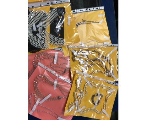 FOLDER WITH LARGE QTY OF COSTUME NECKLACES MAINLY PEARL