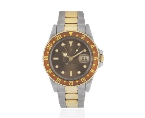 Rolex. A stainless steel and gold automatic calendar bracelet watch with dual time zoneModel: GMT MasterReference: 16753Date: