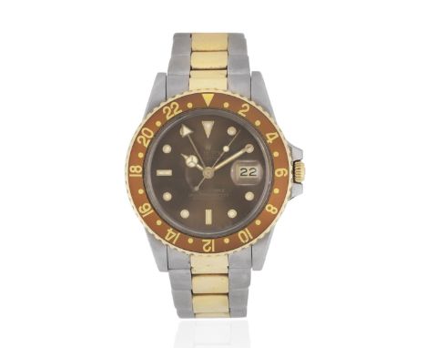 Rolex. A stainless steel and gold automatic calendar bracelet watch with dual time zoneModel: GMT MasterReference: 16753Date: