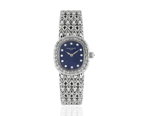 Patek Philippe. A lady's fine 18K white gold and diamond set manual wind bracelet watchModel: EllipseReference: 4931/2G-001Da