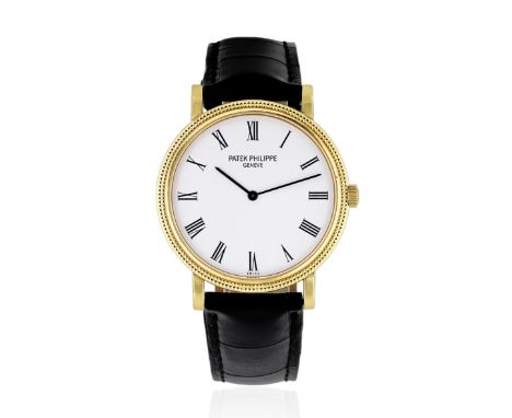 Patek Philippe. An 18K gold automatic wristwatch with hobnail bezelModel: CalatravaReference: 3992JDate: Circa 2000Movement: 