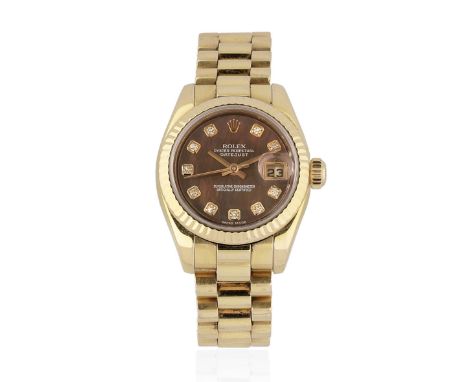 Rolex. A lady's 18K gold and diamond set automatic calendar bracelet watch with mother of pearl dialModel: DatejustReference:
