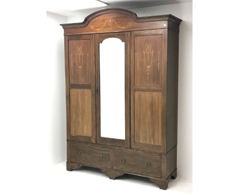 Edwardian mahogany wardrobe, arched pediment and panels inlaid with trailing husks and foliage, central bevelled edge mirror 