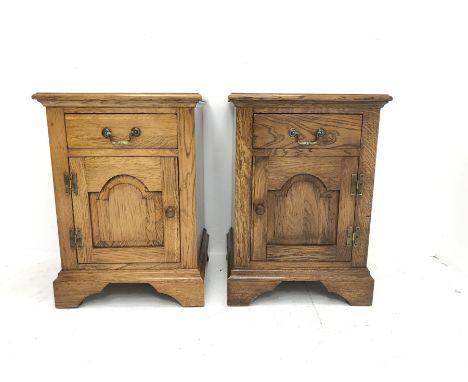 Pair traditional medium oak bedside/lamp cabinets, fitted with cupboard and drawer, W46cm, D43cm, H64cm - Condition Report 