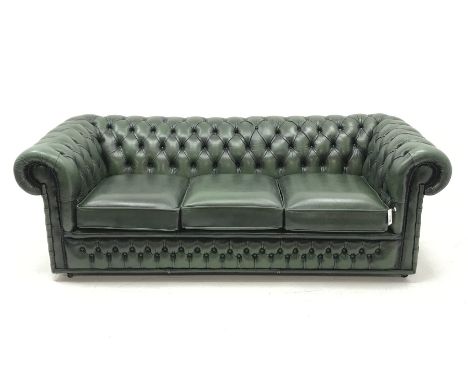 Three seat Chesterfield sofa upholstered in deeply buttoned green leather, W200cm - Condition Report 