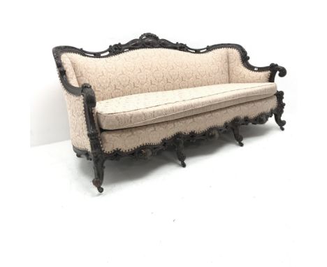 French style carved walnut framed three seat sofa upholstered in alight pink fabric with floral pattern, scrolling cabriole l