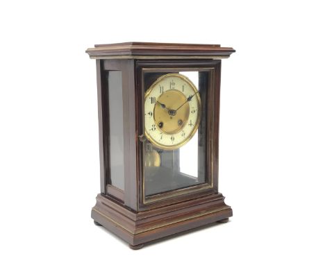 Late 19th century walnut cased mantle clock enclosed by bevelled glazed door and side panels, twin train driven movement stri