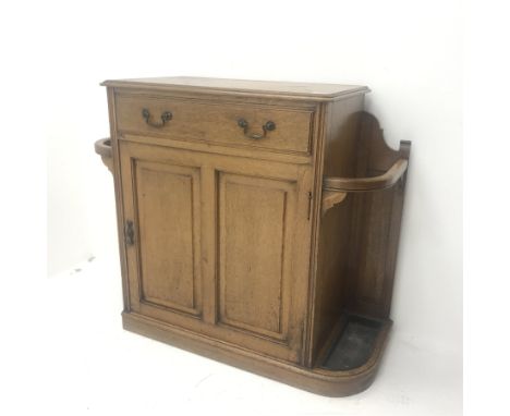 Early 20th century oak hallstand, single drawer above cupboard and stick stand, shaped plinth base, W109cm, H92cm, D44cm - Co